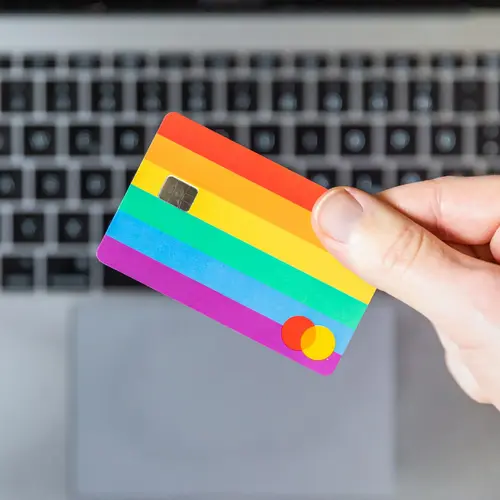 A credit card resting on a laptop