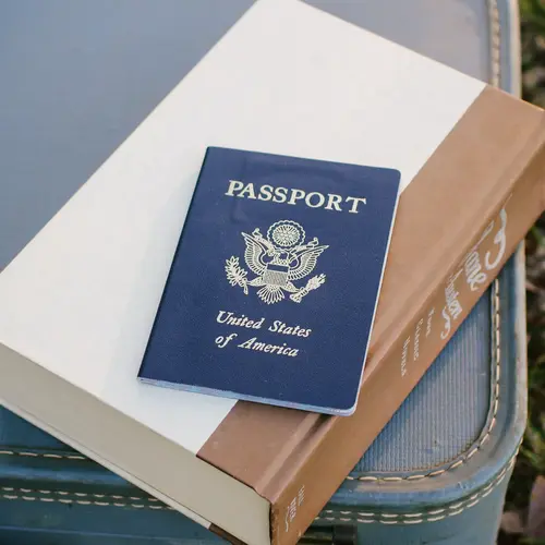 A passport sitting on a book